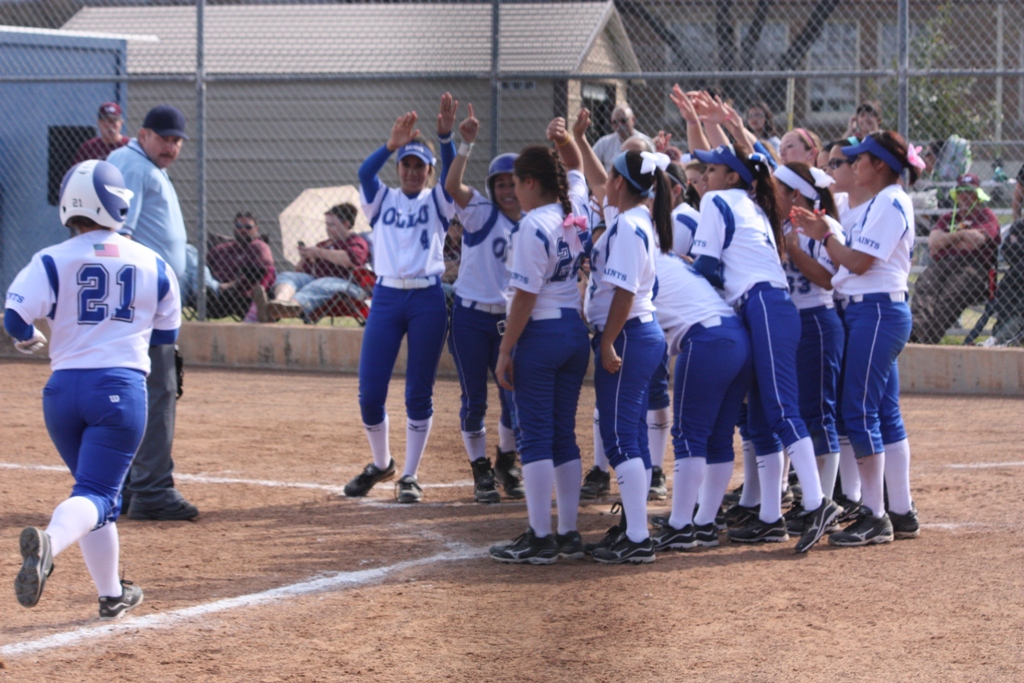 Ashley Perez makes it home after hitting a two-run homer.